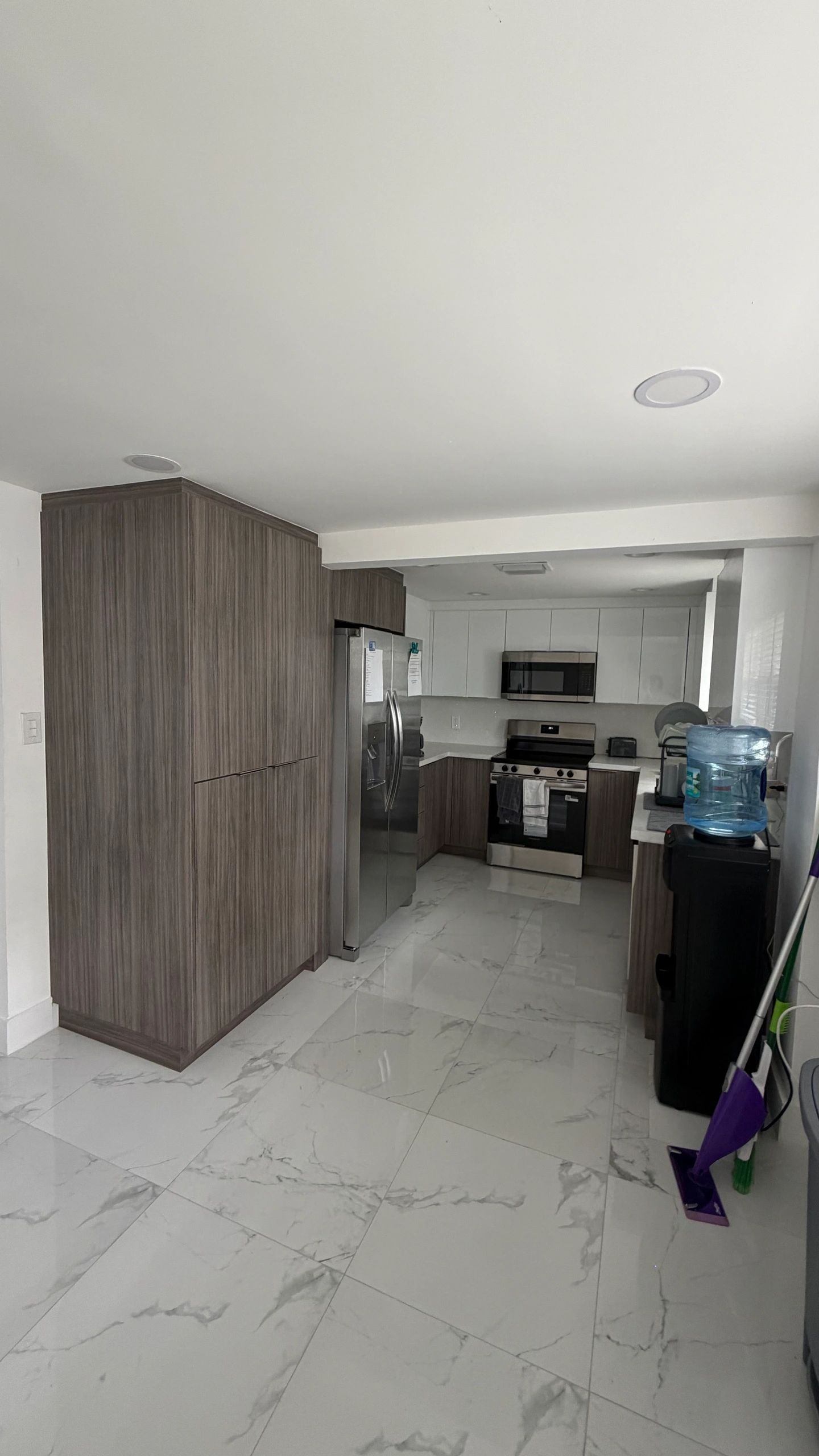 Kitchen cabinetry and appliances at the Miami Central and Flagami residence